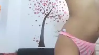 Desi chick with a wide smile strips in free XXX webcam porn show