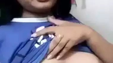 Beautiful desi girl lifting top to reveal sexy boobs