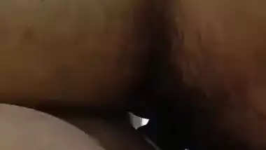 Cute girl gives handjob to boyfriend with condom wearing